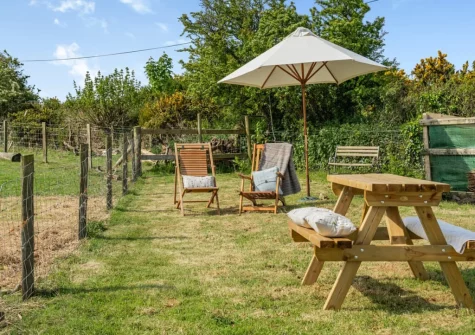 The alfresco dining area & garden at Caerau Bach, Trefin