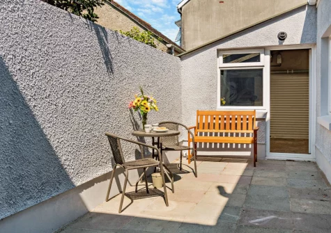 The courtyard patio & outdoor sitting area at Cahbloots, Tenby