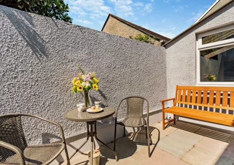 The courtyard patio & outdoor sitting area at Cahbloots, Tenby