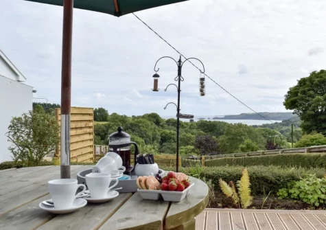 The decked patio, barbecue & alfresco dining area at Caldey View, Stepaside