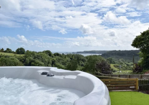 The hot tub & enclosed lawned garden at Caldey View, Stepaside