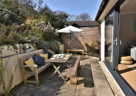 The lower patio & alfresco dining area at Carmarthen Bay View, Saundersfoot