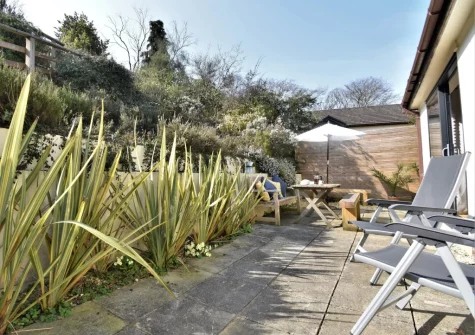 The lower patio & outdoor sitting area at Carmarthen Bay View, Saundersfoot