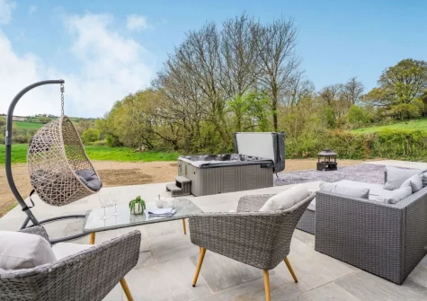 The patio, outdoor sitting area & hot tub at Cefn Gelli, Llawhaden