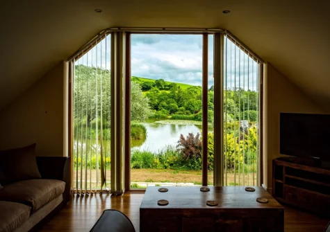 The view across the lake from the living area at Clear View, Llawhaden