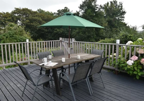 The decked patio & alfresco dining area at Cleggars Castle, Templeton