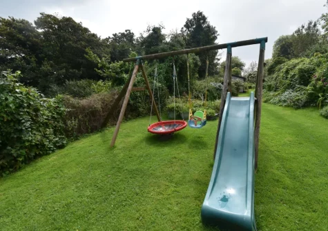 The shared garden with children's play area at Cleggars Castle, Templeton