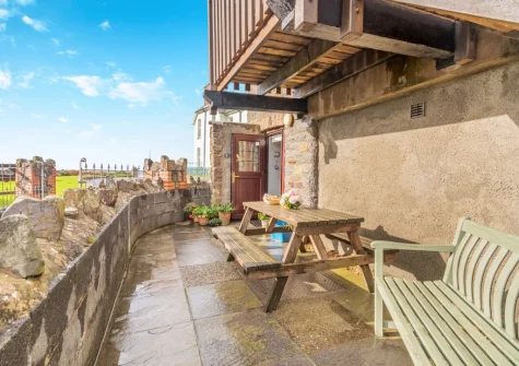 The enclosed courtyard garden & alfresco dining area at Coach House, Broad Haven