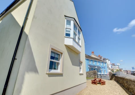 The patio & alfresco dining area at Cockleshell, Amroth