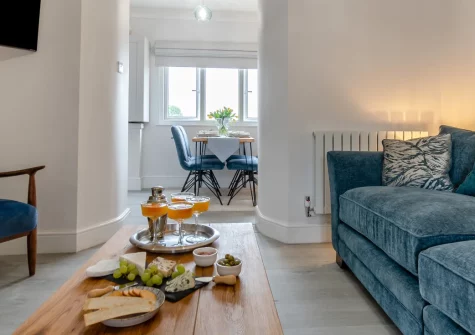 Cove Apartment, Tenby is a beautifully presented second-floor retreat just outside the Medieval town walls, featuring contemporary interiors, two king-size bedrooms, designated parking, and North Beach's golden sands only 300 metres from your door.