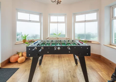 The conservatory, with table football, at Craigwen, Mynytho