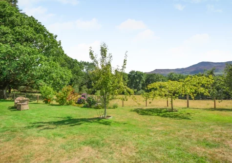 The enclosed lawned garden at Cuddfan Idris, Llanelltyd