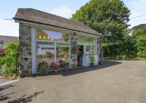 Cuddfan Idris is a stylish barn conversion, with floor-to-ceiling windows boasin far-reaching views across Cadair Idris, that's perfect for two