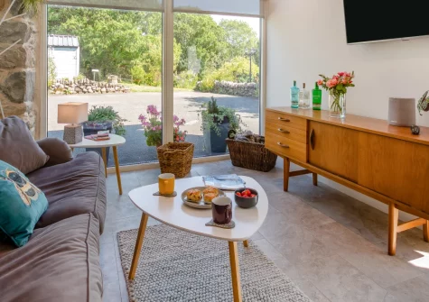 Cuddfan Idris, Llanelltyd is a lovingly converted barn near Dolgellau, offering floor-to-ceiling views of Cadair Idris, a sunny private garden, underfloor heating and prime Dark Sky Reserve stargazing, perfect for couples seeking a peaceful escape.
