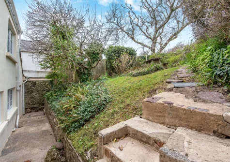 The steps up to the rear garden at Curlew Cottage, Manorbier