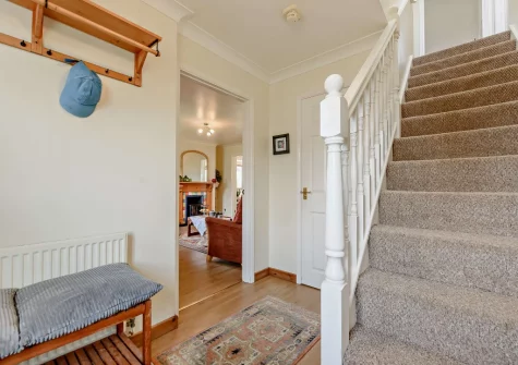 The hallway & stairs up to the first floor at Curlew House, Broad Haven