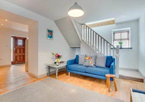 The living room & stairs up to the first floor at Cwt y Bugail, Rhoscefnhir
