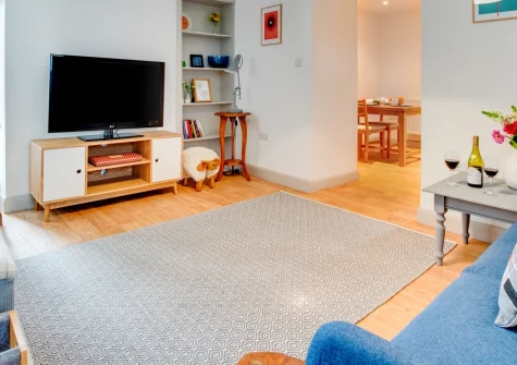Cwt y Bugail, Rhoscefnhir is a cosy two-bedroom cottage on a working Anglesey farm, offering a private balcony, courtyard patio, farm-fresh cheese, and easy access to Red Wharf Bay, Benllech, Menai Bridge and Snowdonia's stunning mountains.