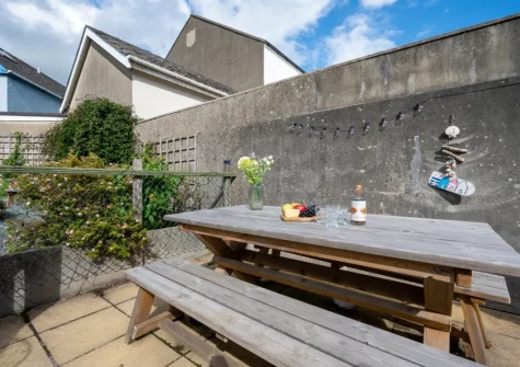 The patio, barbecue & alfresco dining area at Dragon Cottage, Tenby