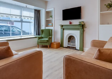 Dragon Cottage, Tenby is a welcoming four-bedroom family retreat just moments from Tenby's golden beaches, featuring a children's bunk room with arcade games, generous garden with basketball hoop and barbecue, and access to historic harbour charm.