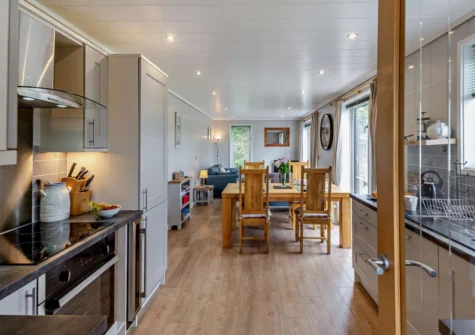 The kitchen & dining area at Dragonfly Lodge, Tyn-y-Groes