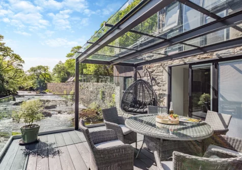The decked terrace & alfresco dining area at Drws Y Coed, Capel Curig