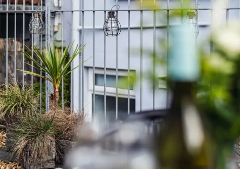 Step out, up 9 stairs, into the enclosed courtyard garden, barbecue & outdoor sitting area