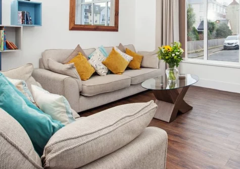Ein Lle, Tenby is a charming two-bedroom apartment in the heart of this historic harbour town, featuring a peaceful enclosed courtyard garden with barbecue, contemporary interiors, and immediate access to golden beaches and Georgian streets.