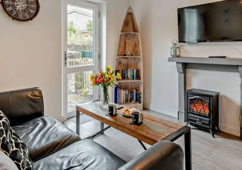 Foxglove Cottage, Broad Haven is a charming dog-friendly two-bedroom coastal retreat just 250m from golden sands. Enjoy a sun-trap courtyard garden, cosy interiors, and easy access to Pembrokeshire's stunning coastal paths and local attractions.