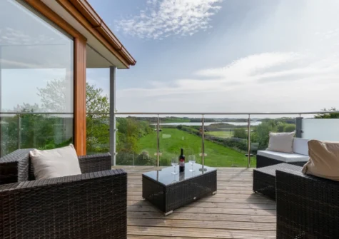 The decked balcony & outdoor sitting area at Ger y Bont, Valley