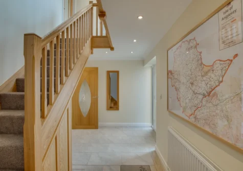 The hallway & stairs up to the first floor at Ger y Bont, Valley