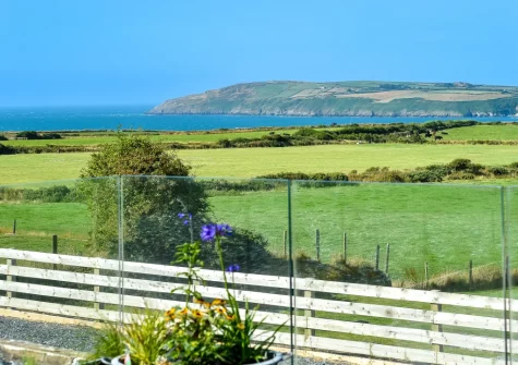 The coast & sea view from the patio & alfresco dining area at Geufron House, Aberdaron