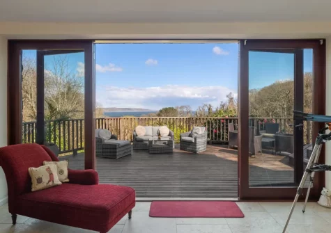 The living room, leads out on to the wrap-around decked terrace, at Glendale, Saundersfoot