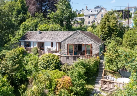 The split-level enclosed garden, with wood-fired hot tub, at Glendale, Saundersfoot