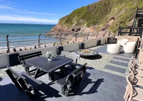 The enclosed patio & alfresco dining area at Graftons, Little Haven