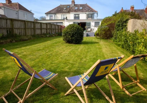 The enclosed lawned garden & outdoor sitting area at Green Meadows, Newport