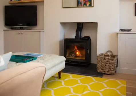 Green Meadows, Newport is a beautifully refurbished four-bedroom house sleeping eight, featuring a wood burner, raised deck with east-facing garden, and firepit, just 500 metres from Parrog Beach and Newport's friendly town centre.