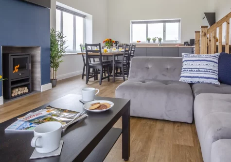 Cwt y Bugail, Rhoscefnhir is a cosy two-bedroom cottage on a working Anglesey farm, offering a private balcony, courtyard patio, farm-fresh cheese, and easy access to Red Wharf Bay, Benllech, Menai Bridge and Snowdonia's stunning mountains.