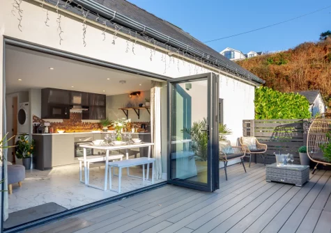 The decked terrace, barbecue & outdoor sitting area at Hafan Glas, Abersoch