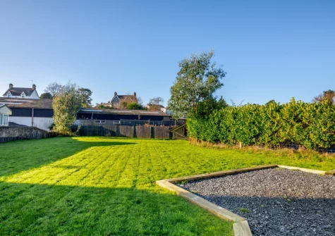 The enclosed lawned garden at Hafan Glas, Abersoch