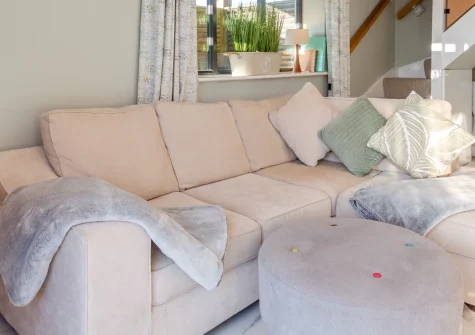 Hafan Glas, Abersoch is a vibrant contemporary retreat just 200 metres from the harbour, featuring a spacious enclosed garden with decking and lawn, bright open-plan living with coastal views, and three stylish bedrooms close to Abersoch's beaches.