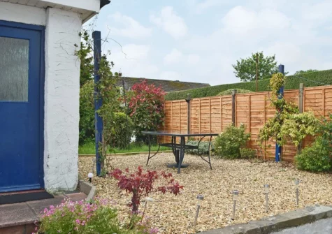 The barbecue, alfresco dining area & garden at Hafan, Tenby
