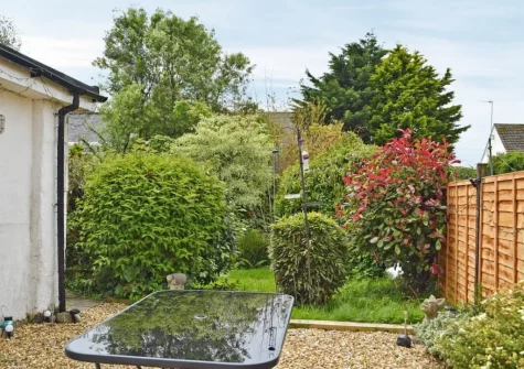 The barbecue, alfresco dining area & garden at Hafan, Tenby
