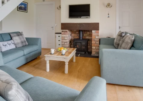 Hafan y Traeth, Sandy Haven is a spacious four-bedroom cottage in peaceful Pembrokeshire countryside, just over 300 metres from Sandy Haven's sheltered bay, featuring vaulted ceilings, a wood burner, and the dramatic coastal path on your doorstep.