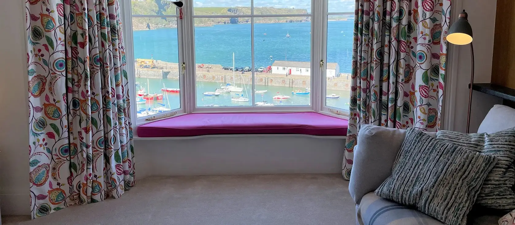 Harbour Beach View, Tenby is a magnificent seafront apartment with breathtaking harbour views. Located steps from beach, shops, and restaurants, it's ideal for families and couples seeking traditional seaside charm and coastal memories.