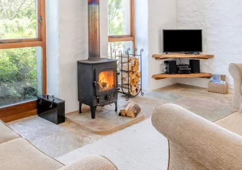 Harmony Cottage, Trefasser is a beautifully converted barn on a peaceful Pembrokeshire smallholding, featuring rustic charm with contemporary comfort, wood burner warmth, countryside views, and footpaths leading directly to the coast and villages.