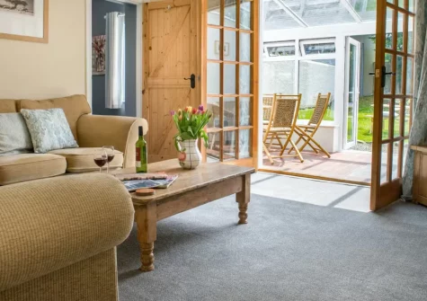Hawthorn Cottage at Woodlands Farm, Little Haven is a characterful three-bedroom retreat sleeping seven above this picturesque seaside village, boasting sweeping St Bride's Bay views, a sunny south-facing garden, and woodland trails to beaches.