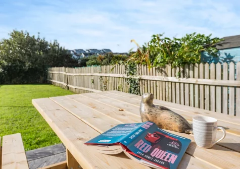 The alfresco dining area & enclosed garden at Heddfan, Broad Haven