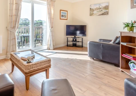 Heddfan, Broad Haven is a spacious three-storey home just moments from the golden sands of Broad Haven beach, featuring a sunny balcony with garden views, stylish family-friendly interiors, and an enclosed garden perfect for children and dogs.