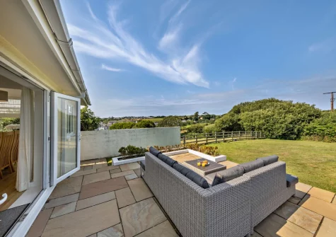 The patio, outdoor sitting area & enclosed lawned garden at Hillside, Abersoch